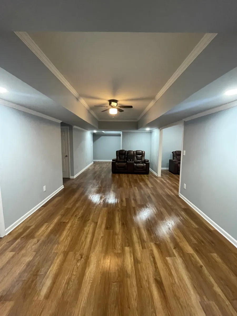 Finished basement with wood-look flooring in Hampton GA